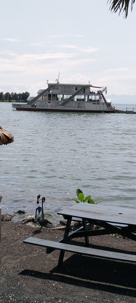 Boat on a peaceful lake for a Lake Kivu add-on